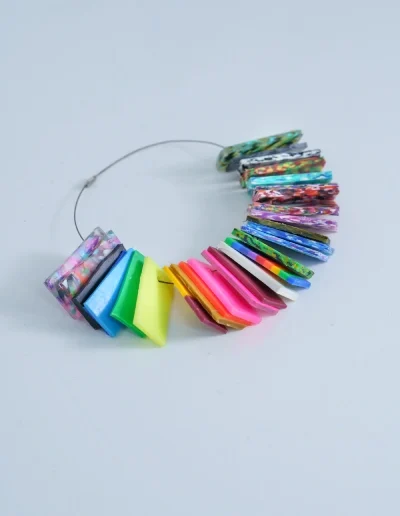 Colour samples of denture base materials arranged on a display ring for shade selection.