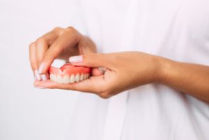 putting dentures in for the first time set
