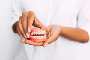 person holding a mouth model
