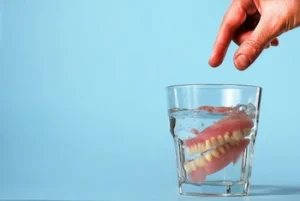 cleaning dentures in water
