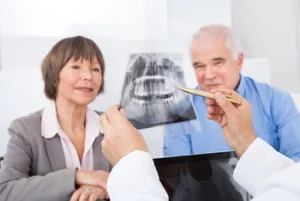 talking with doctor during dentures consult